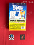 LLOYD_124 - Grays Sports Almanac Book Universal Back To The Future Prop Replica Autographed By Christopher Lloyd