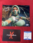 MELA_004 - 8x10 Metallic Photo Autographed By Mela Lee