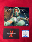 MELA_014 - 8x10 Metallic Photo Autographed By Mela Lee