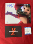 MELA_093 - 8x10 Metallic Photo Autographed By Mela Lee
